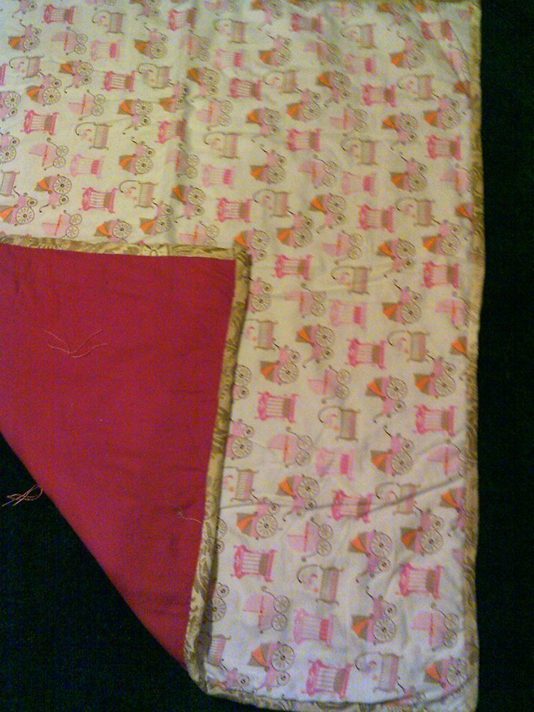 38" x 44" "Baby Buggies" flannel blanket with hot pink backing $55